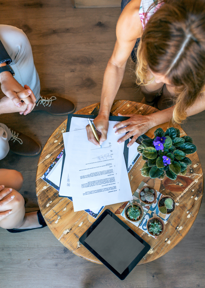 Top view of woman signing divorce papers