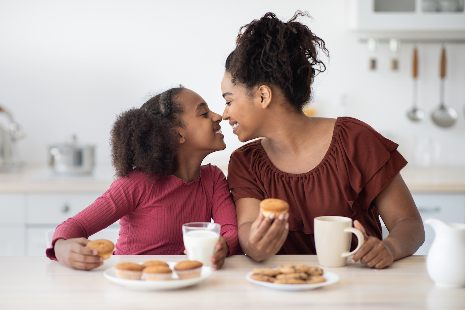 Happy african american mom and daughter enjoying time together